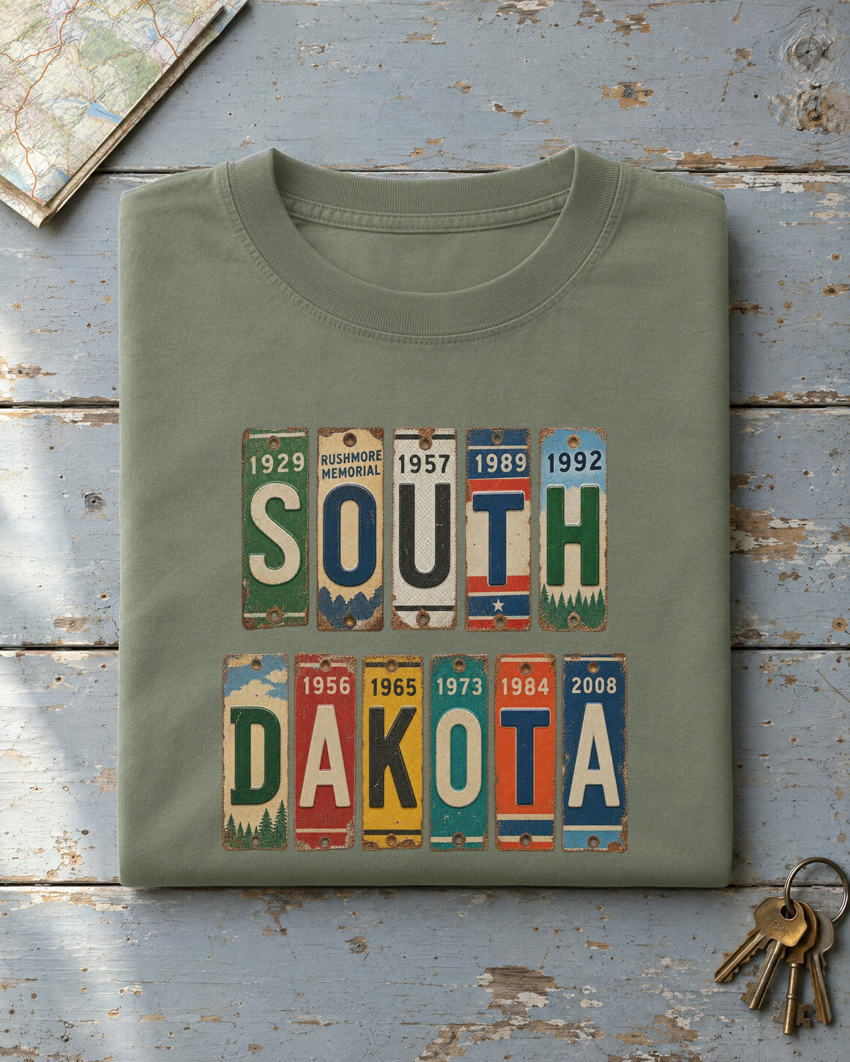 South Dakota vintage license plate t-shirt in Moss