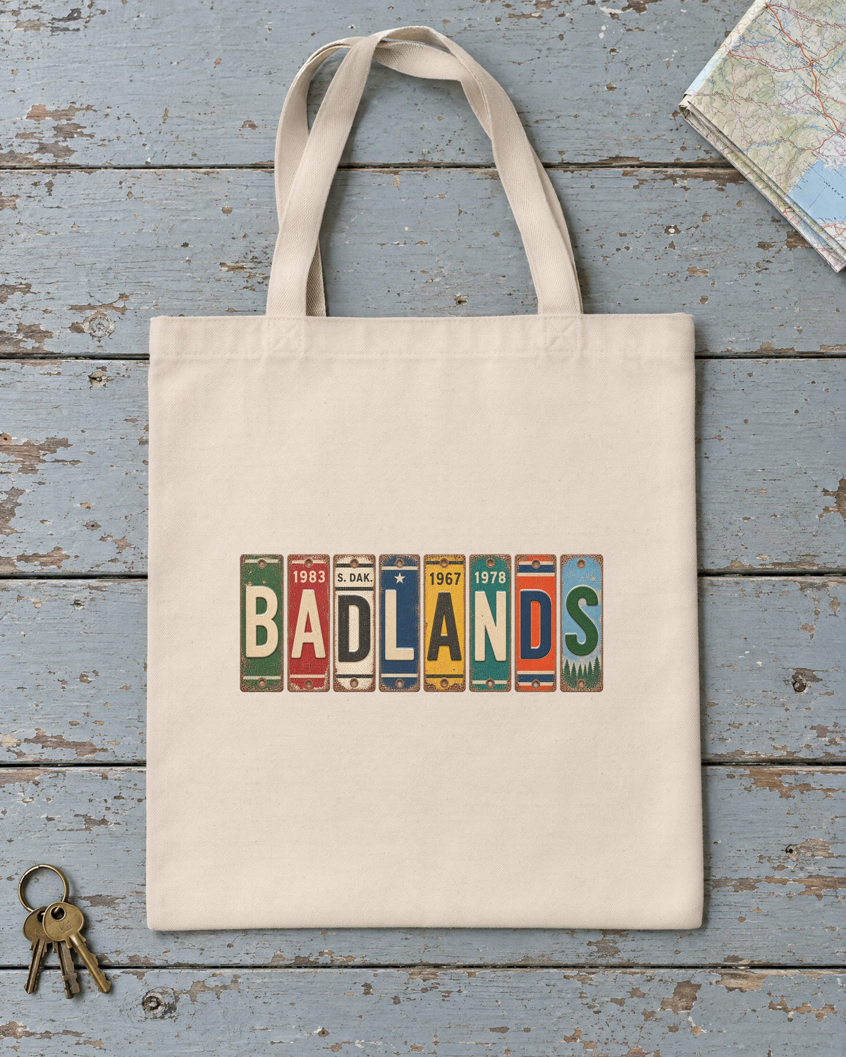 Badlands, South Dakota vintage license plate tote bag in Natural