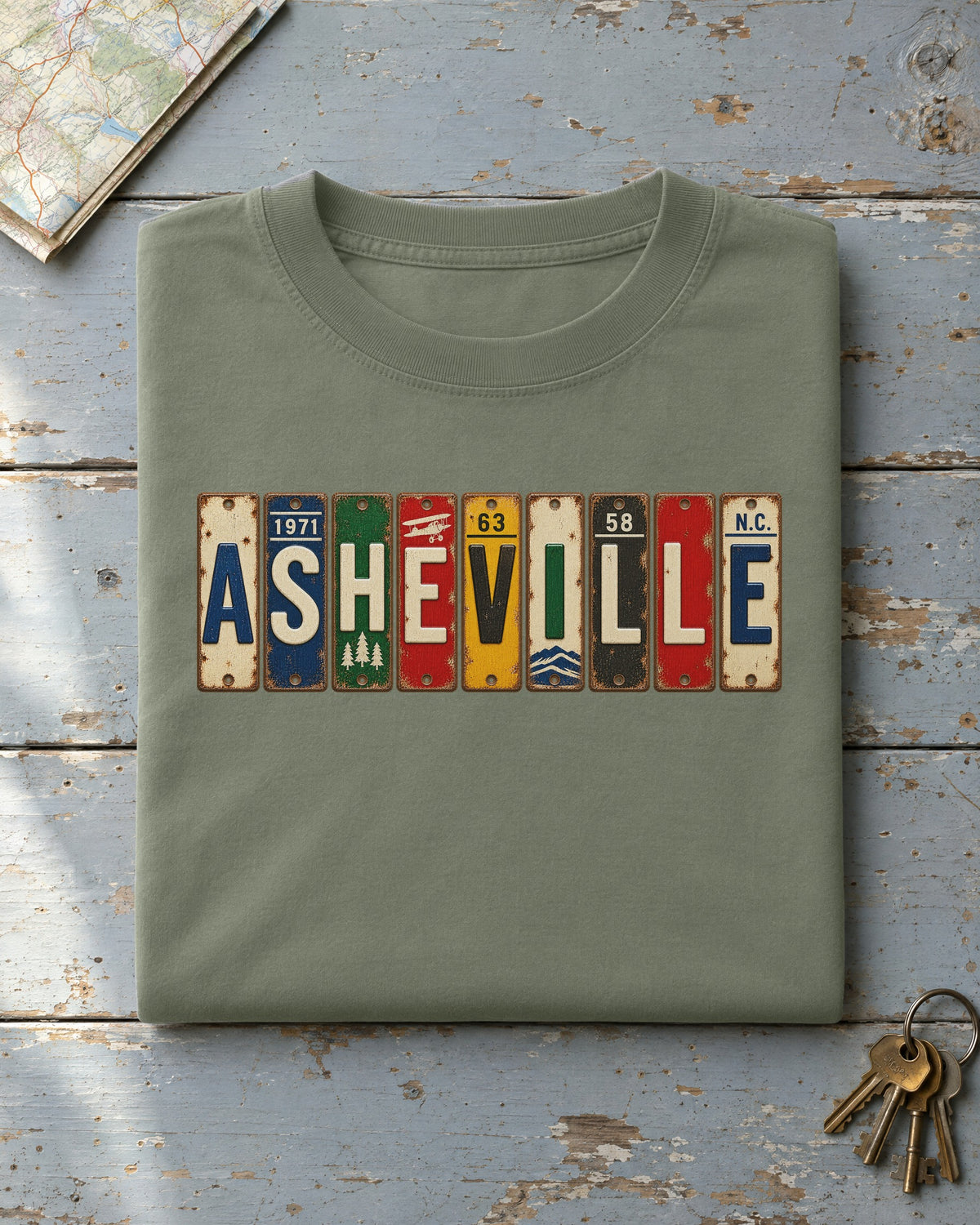 Asheville, North Carolina vintage license plate t-shirt in Moss