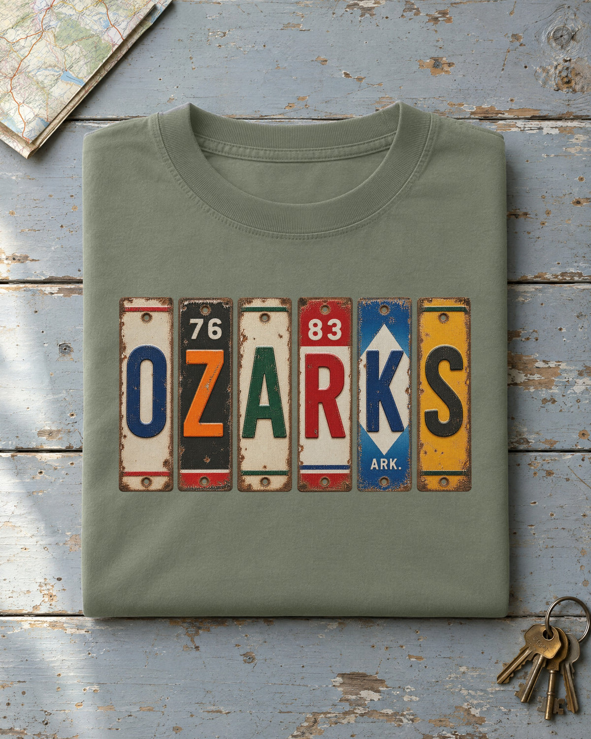 Ozarks, Arkansas vintage license plate t-shirt in Moss