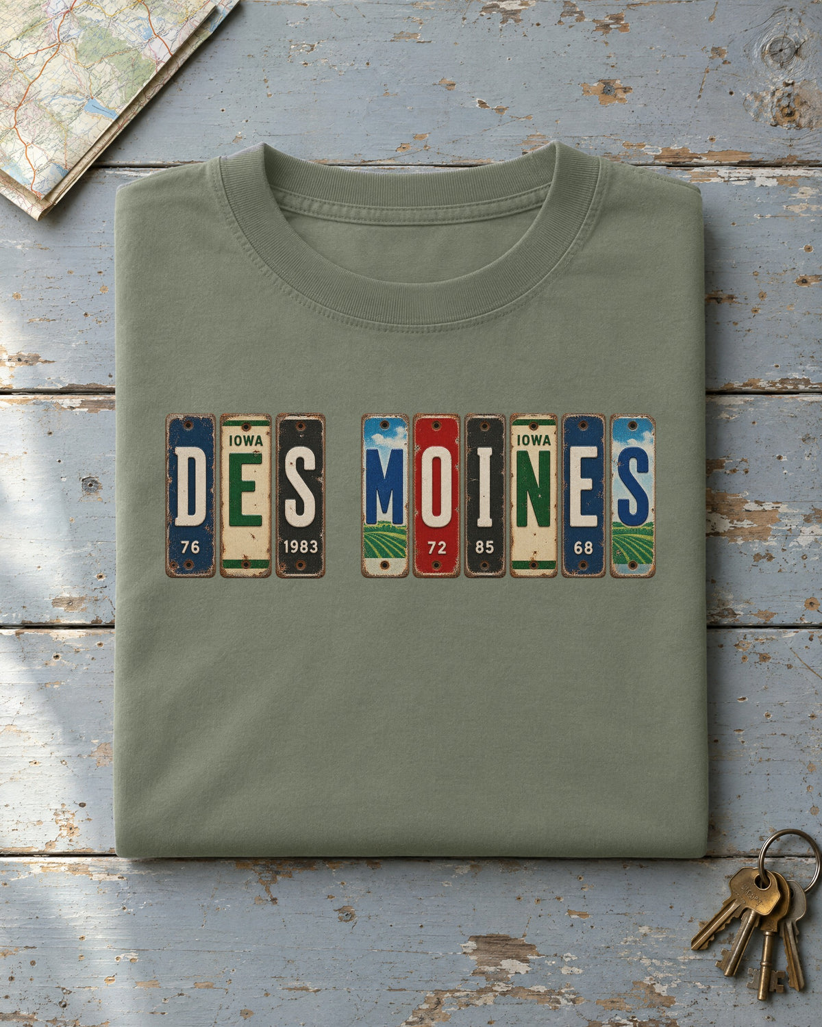 Des Moines, Iowa vintage license plate t-shirt in Moss