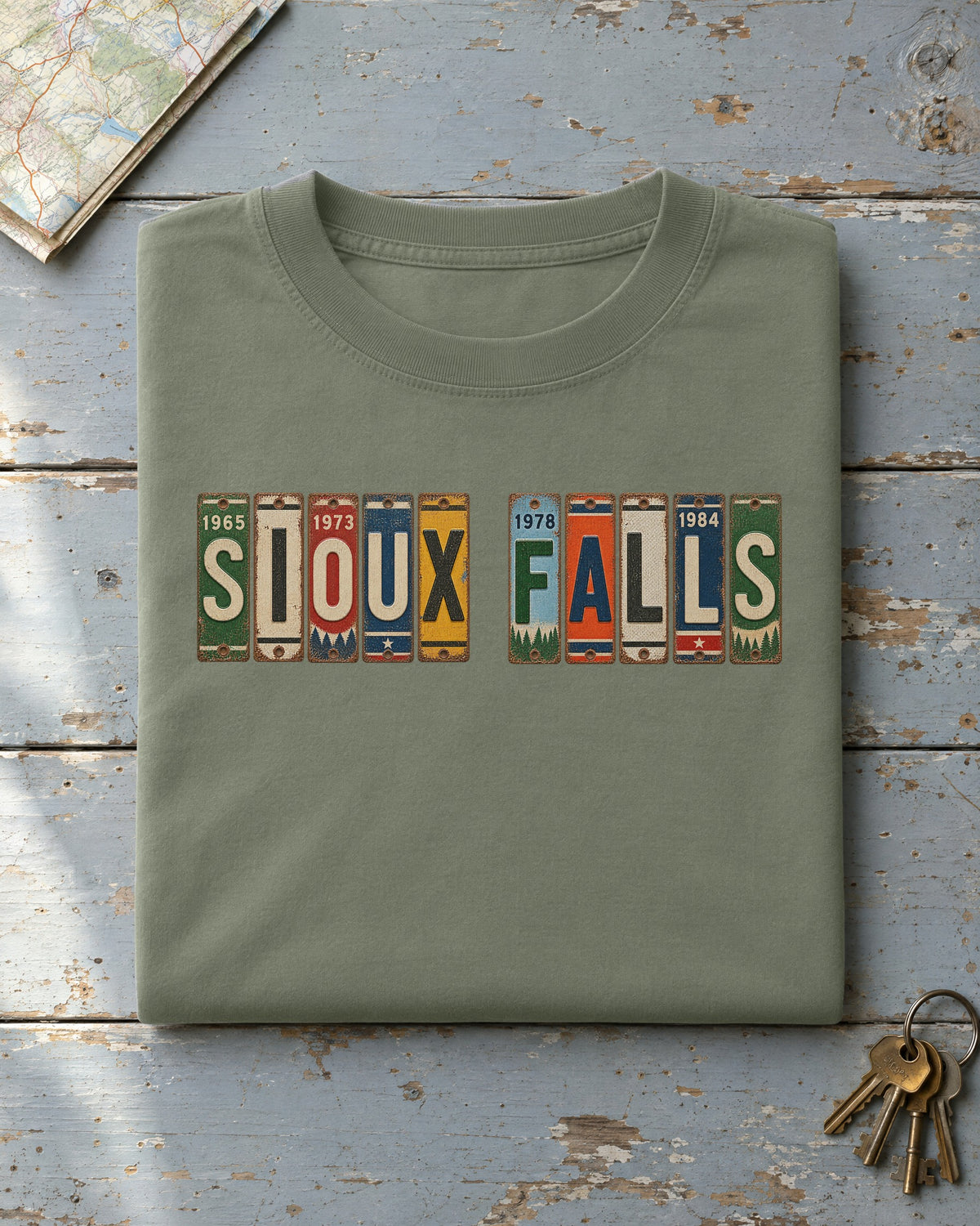 Sioux Falls, South Dakota vintage license plate t-shirt in Moss