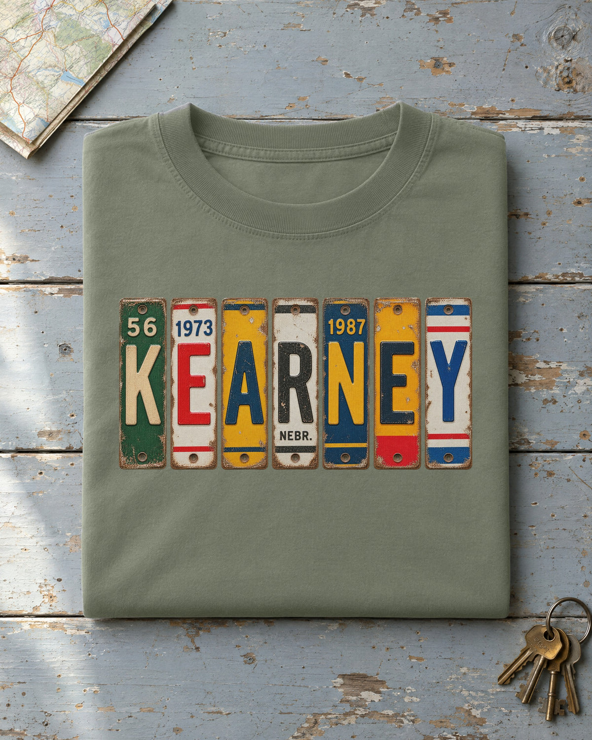Kearney, Nebraska vintage license plate t-shirt in Moss