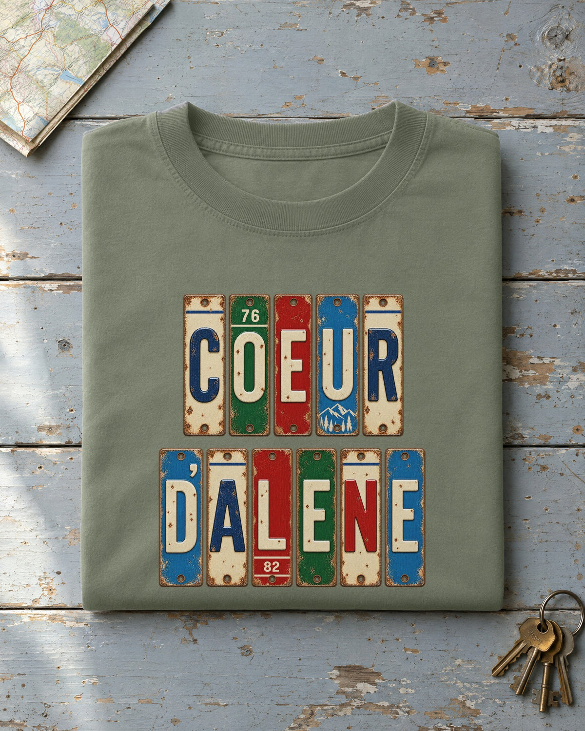 Coeur d'Alene, Idaho vintage license plate t-shirt in Moss