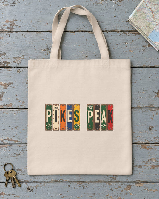 Pikes Peak, Colorado vintage license plate tote bag in Natural