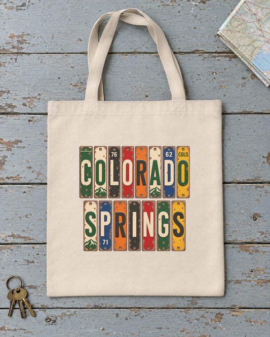 Colorado Springs, Colorado vintage license plate tote bag in Natural